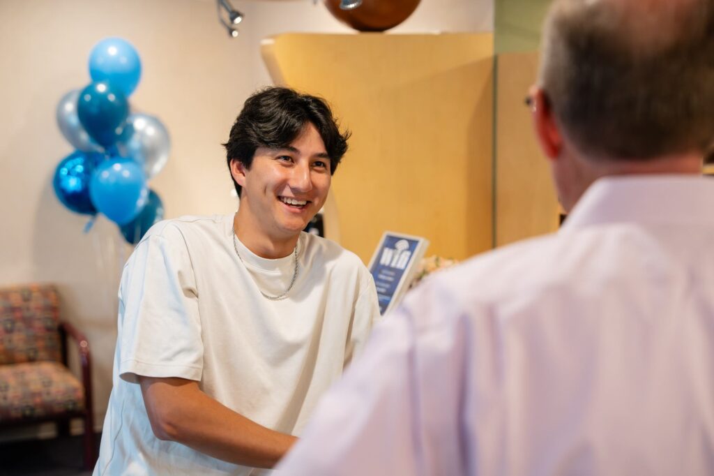 Orthodontist serving Grafton WI families at Kittleson Orthodontics with patient during care visit